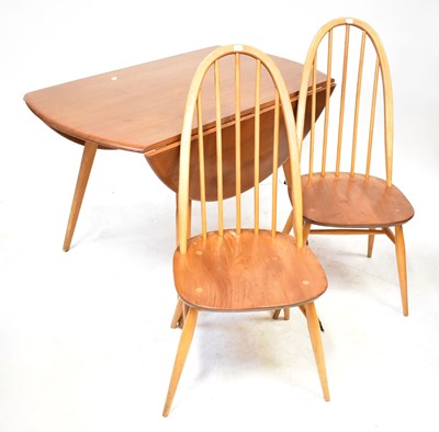 Lot 11 - ERCOL; an elm oval drop-leaf table, raised on...