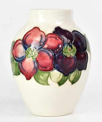 Lot 226 - MOORCROFT; a cream ground 'Clematis' pattern...