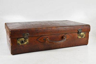 Lot 1288 - A brown leather suitcase, bearing initials 'N....