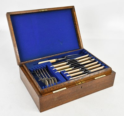 Lot 1452 - An oak cased canteen of cutlery.
