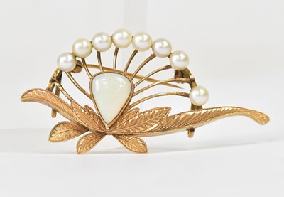 Lot 827 - An 18ct yellow gold floral brooch set with...