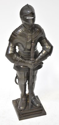 Lot 534 - A large cast iron fireside companion set in...