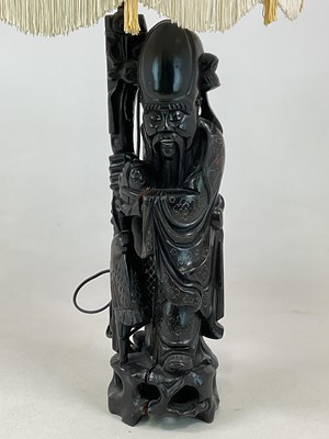 Lot 239 - A Chinese ebonised hardwood table lamp in the...