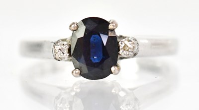 Lot 798 - A white metal ring set with an oval cut...