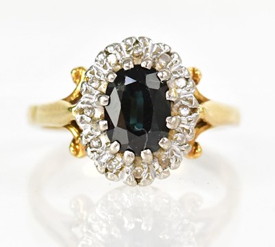 Lot 743 - An 18ct yellow gold cluster ring set with an...
