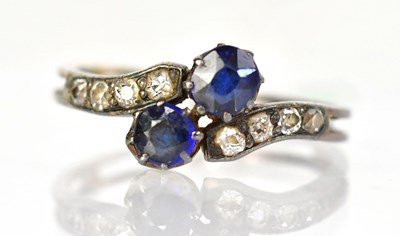 Lot 799 - A yellow and white metal crossover ring set...