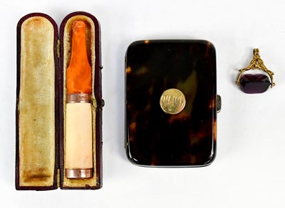 Lot 925 - A yellow metal watch fob set with cut amethyst,...