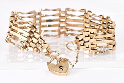 Lot 813 - A 9ct gold six-bar gate bracelet with...