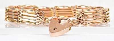 Lot 812 - A 9ct gold five-bar gate bracelet with...