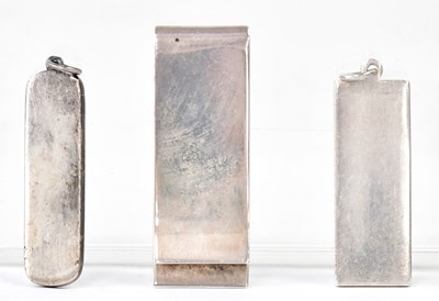 Lot 877 - Two silver ingots mounted as pendants, and a...