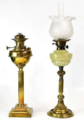 Lot 146 - A brass oil lamp with the stem in the form of...
