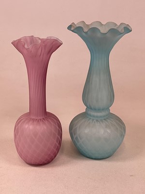 Lot 215 - Two quilted satin art glass vases, both with...
