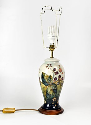 Lot 151 - MOORCROFT; a 'Bramble' pattern lamp of...