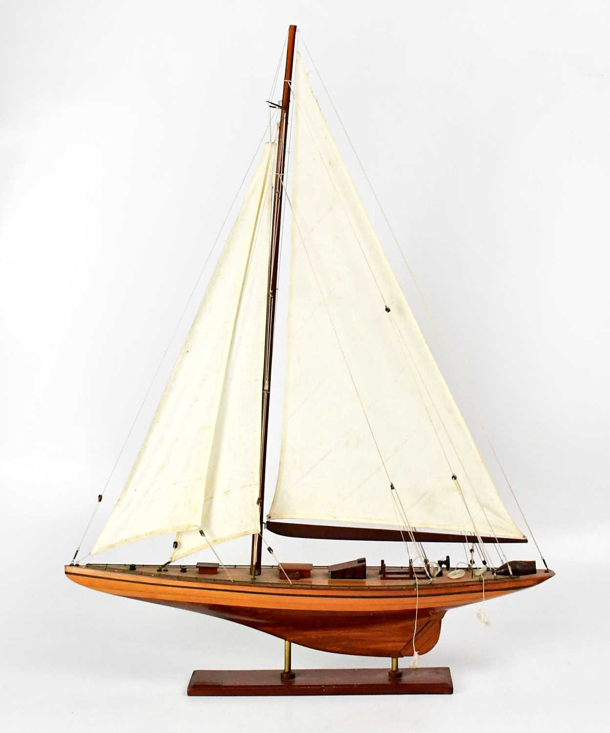 Lot 232 - A model of a single-masted sailing ship,...