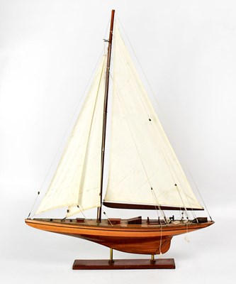 Lot 232 - A model of a single-masted sailing ship,...