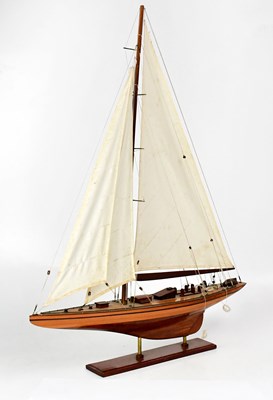 Lot 232 - A model of a single-masted sailing ship,...