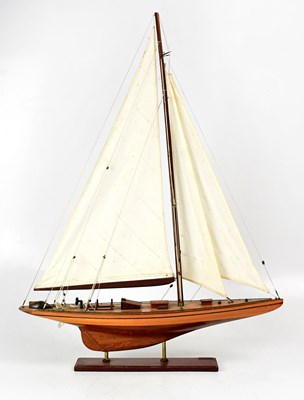 Lot 232 - A model of a single-masted sailing ship,...