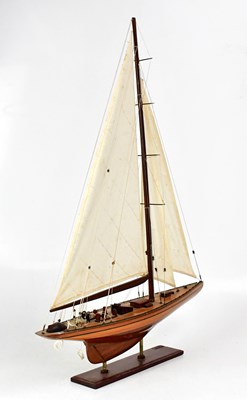 Lot 232 - A model of a single-masted sailing ship,...