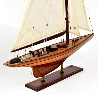 Lot 232 - A model of a single-masted sailing ship,...