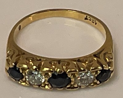 Lot 360 - An 18ct yellow gold sapphire and diamond five...