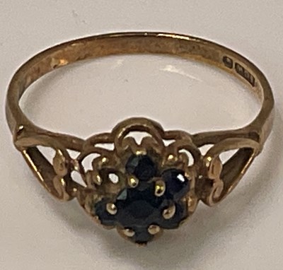 Lot 415 - A yellow metal flower head dress ring (one...
