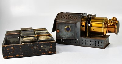 Lot 433 - A brass and metal cased magic lantern in metal...