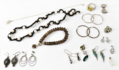 Lot 945 - A quantity of sterling silver and white metal...