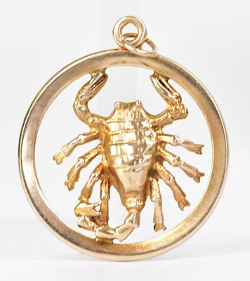 Lot 864 - A 9ct gold circular openwork pendant set with...