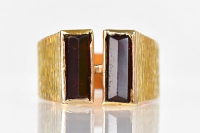 Lot 802 - A yellow metal bark-effect ring set with a...