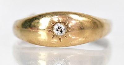 Lot 755 - An 18ct gold ring with central diamond in a...