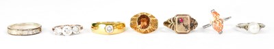 Lot 805 - Seven dress rings, to include pearl, white...