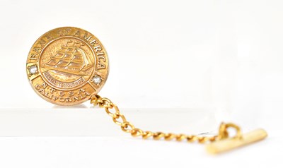 Lot 829 - A 10ct gold tie pin of circular form, 'Bank of...