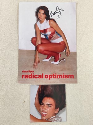 Lot 261 - DUA LIPA; a signed promotional photograph and...