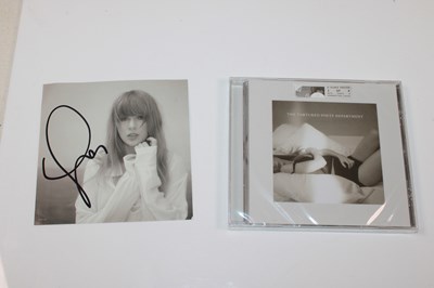 Lot 260 - TAYLOR SWIFT; a signed CD slip, also a CD for...