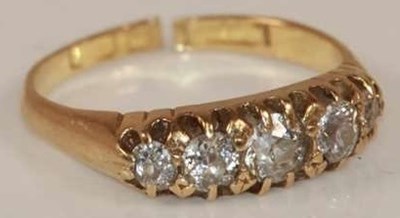 Lot 378 - An 18ct yellow gold five stone graduated...