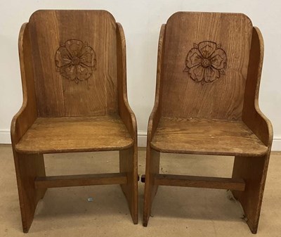 Lot 525 - A pair of carved light oak wing back chairs...