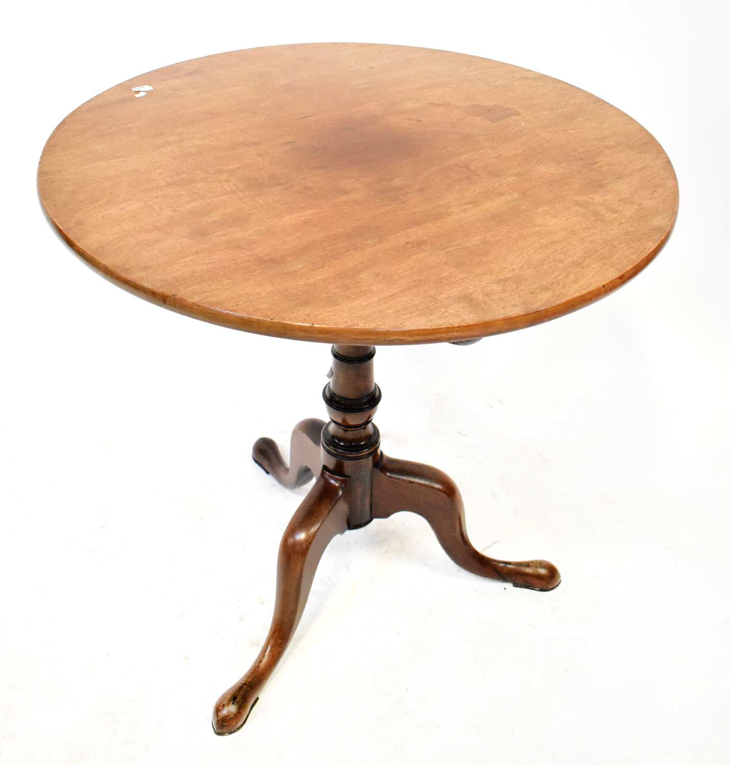 Lot 17 - A George III mahogany circular tilt-top table...