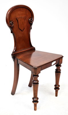 Lot 119 - A 19th century mahogany hall chair with spoon...