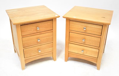 Lot 67 - A pair of waxed pine bedside tables, each with...