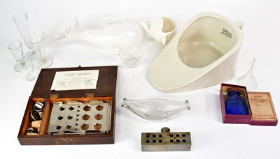 Lot 374 - A cased set of closing machines, various glass...