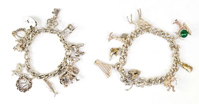 Lot 825 - Two hallmarked silver charm bracelets with...