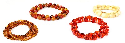 Lot 883 - Four vintage beaded necklaces, comprising a...