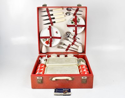 Lot 211 - A Brexton four-setting picnic set in red case,...