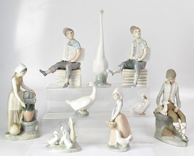 Lot 184 - NAO; nine figures, comprising a pair of boys...