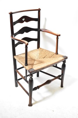 Lot 52 - A 19th century country rush seated ladder-back...