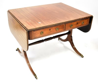 Lot 36 - A Regency mahogany sofa table with a pair of...
