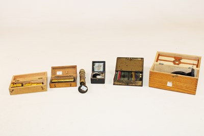 Lot 1115 - Four travelling pocket microscopes, a cased...