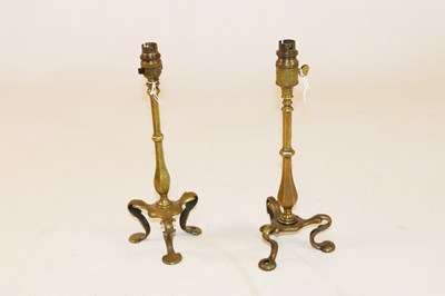 Lot 1220 - A matched pair of brass Art Nouveau table...