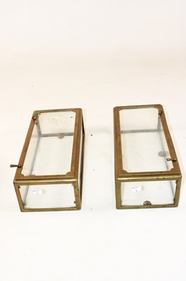 Lot 1077 - An unusual pair of brass mounted glazed wall...