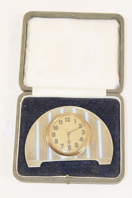 Lot 1202 - A cased Art Deco brass and enamelled eight day...